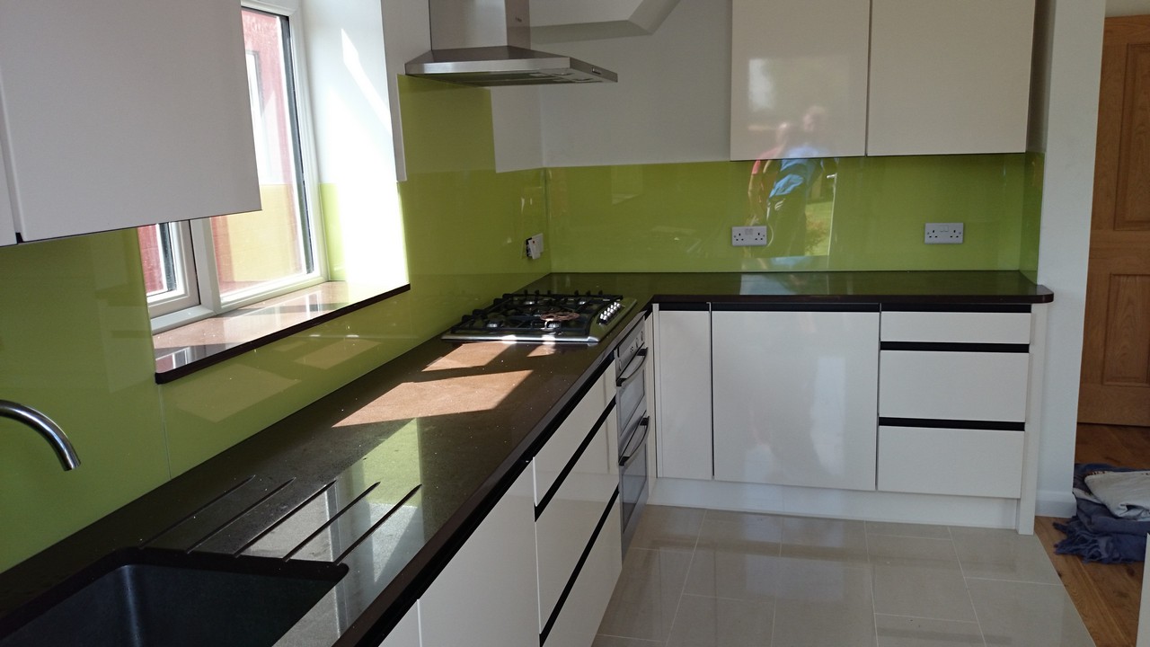Lime green glass kitchen splashback installed by Borehamwood glaziers